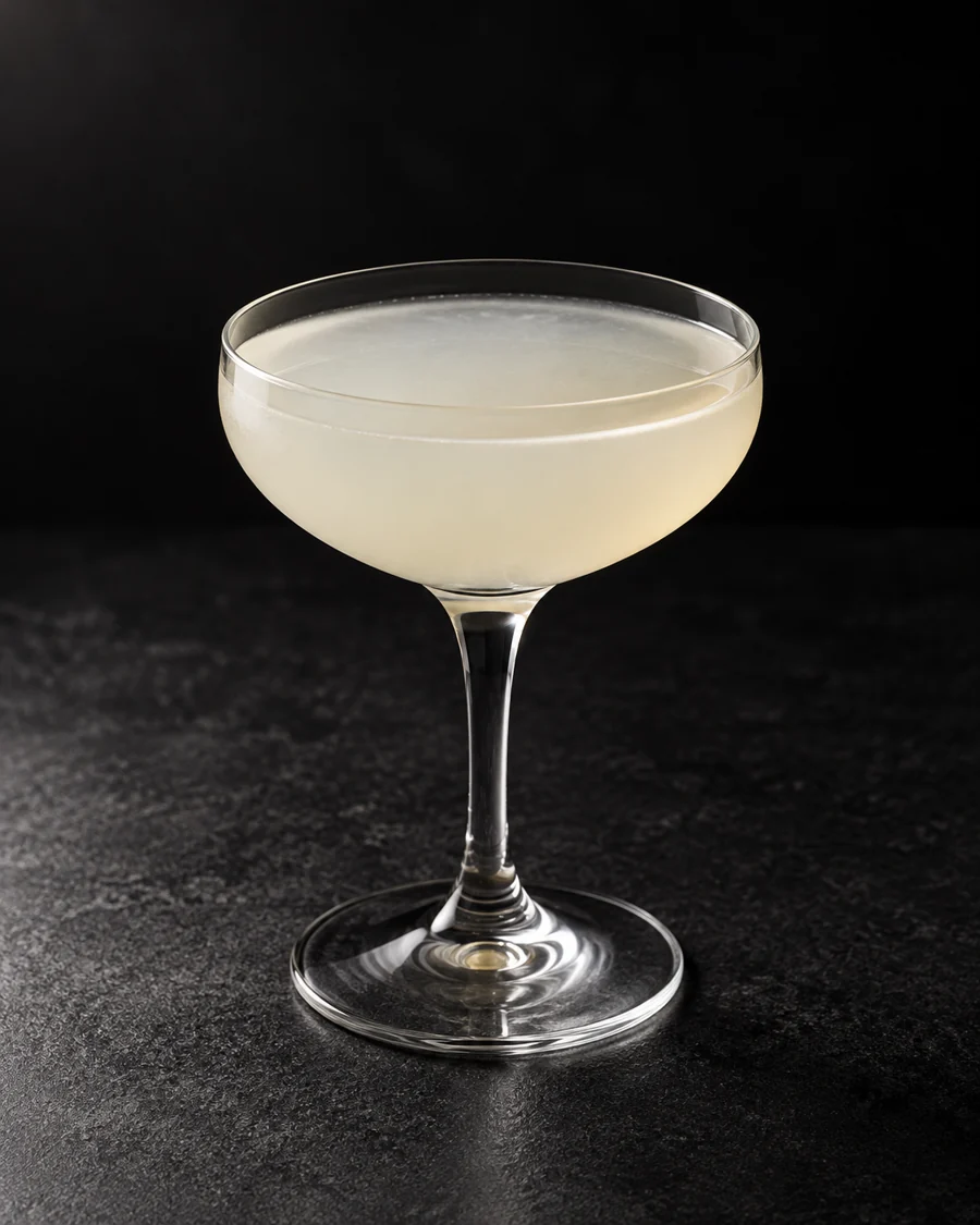 Pale, lightly cloudy Kamikaze in a small coupe without ice or garnish.